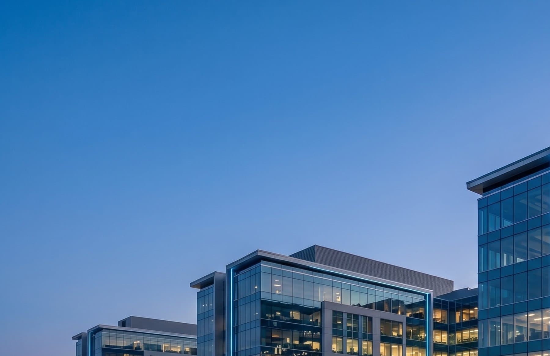 An OCOA commercial real estate campus at dusk.